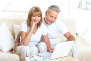 7231952-Seniors-couple-working-with-laptop-at-home--Stock-Photo-couple-mature-computer